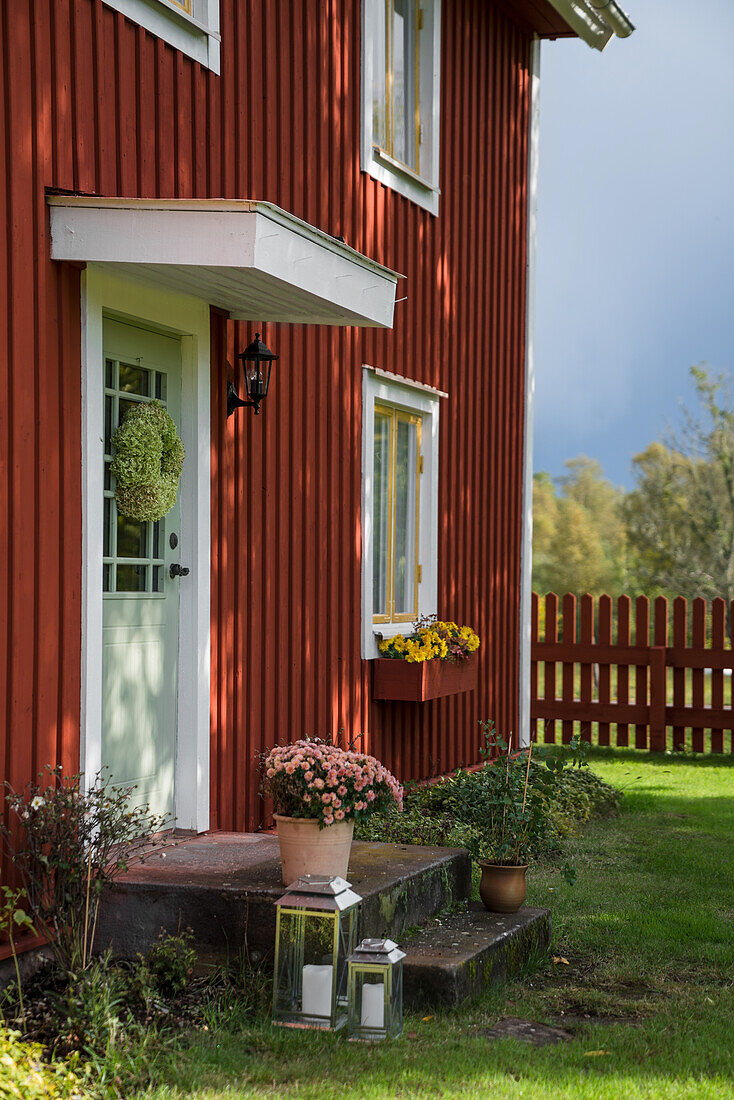 Red-brown wooden house, entrance area