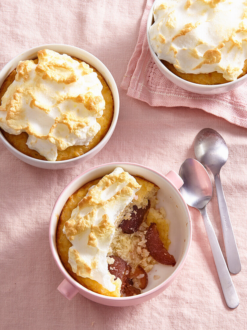 Baked rice pudding with plums and meringue topping