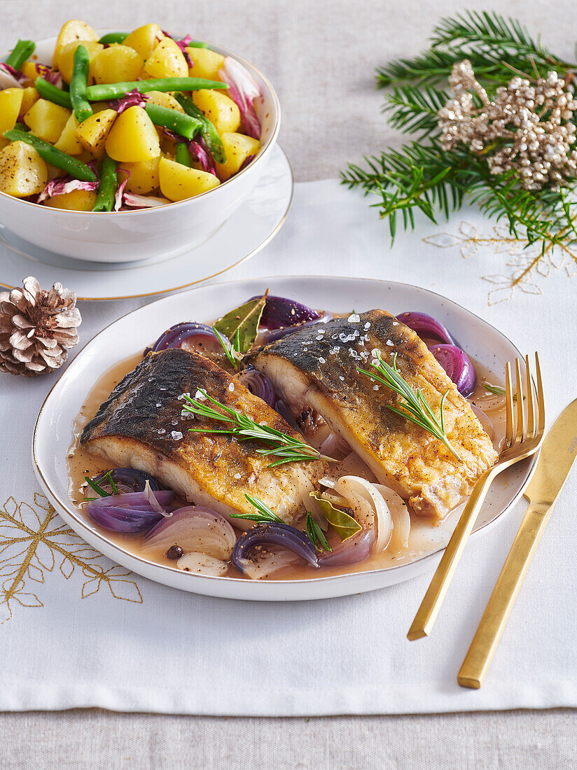 Braised carp fillets served with potato and bean salad