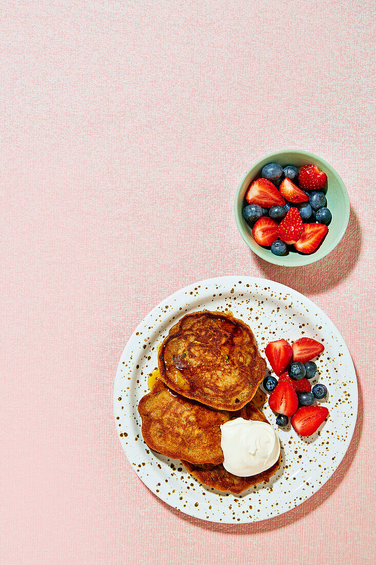 Gluten-free zucchini pancakes with berries