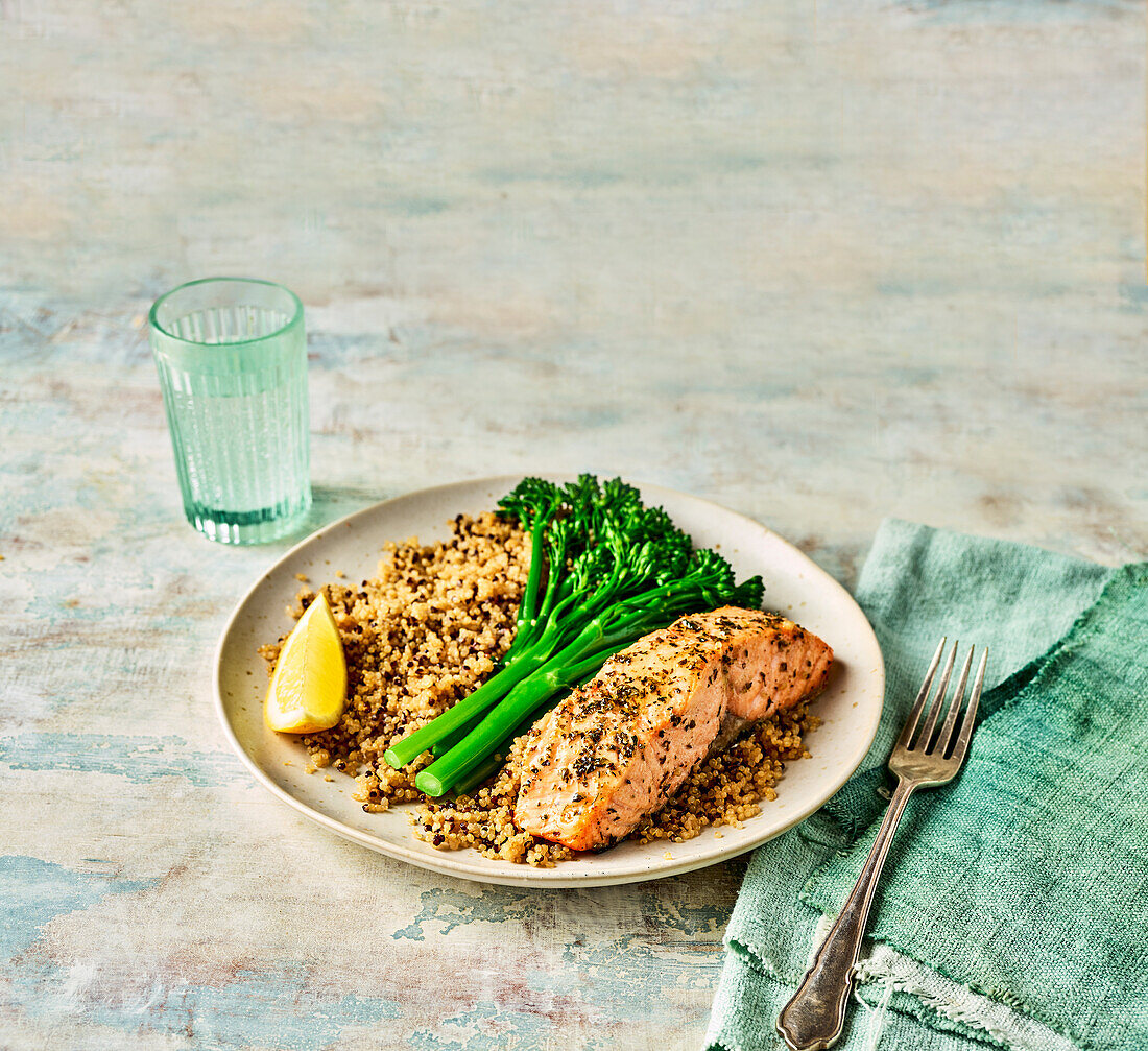 Salmon cooked in an air fryer with quinoa and broccolini