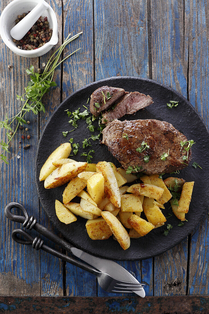 Beef steak with roasted potatoes