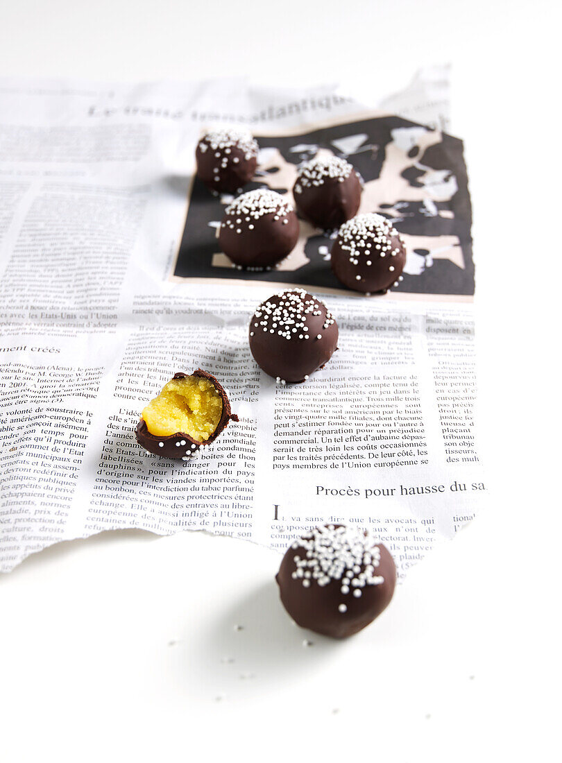 Lemon cake balls coated in chocolate icing