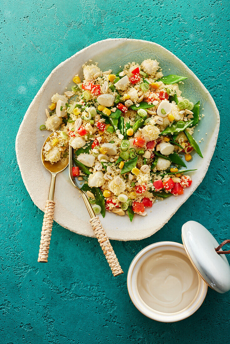 Colourful couscous salad with vegetables and mini-mozzarella