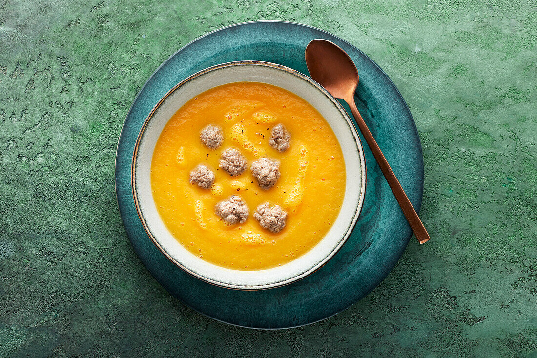 Carrot soup with meatballs