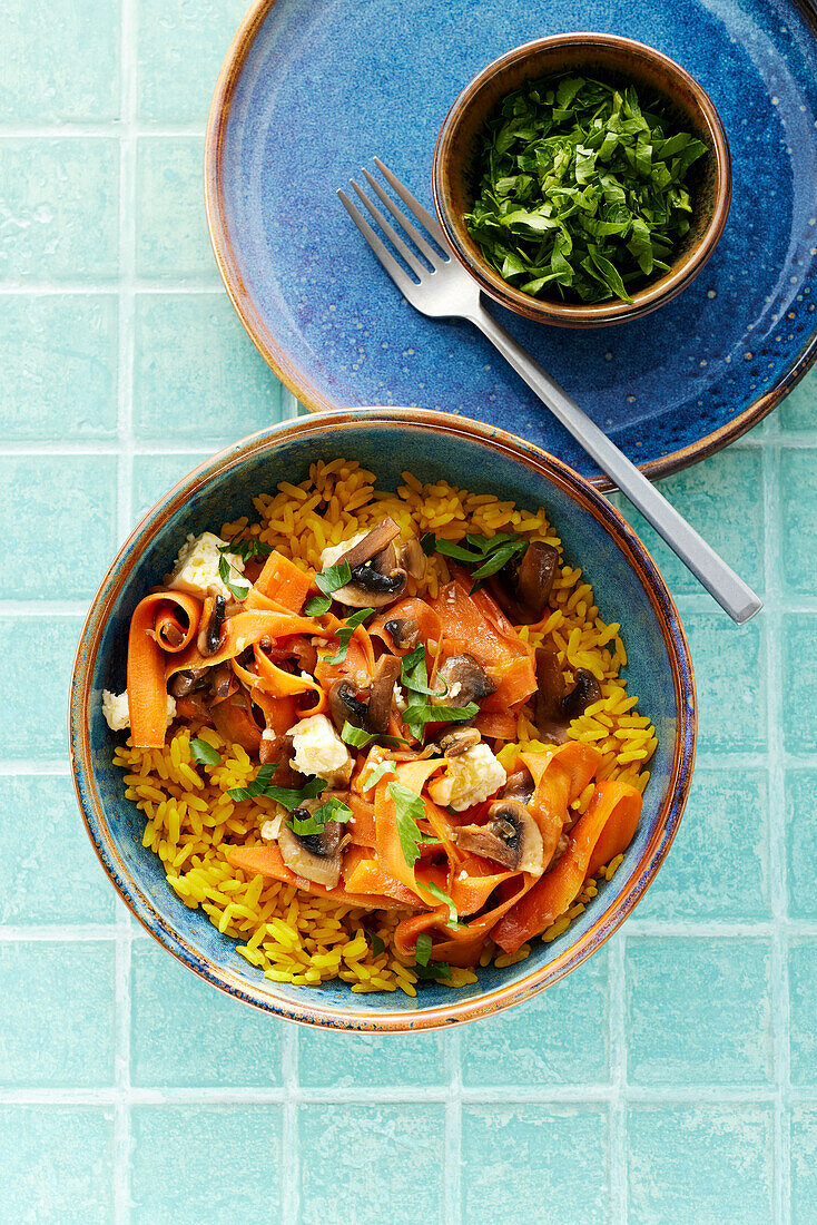 Spiced rice with vegetables, feta cheese and mushrooms