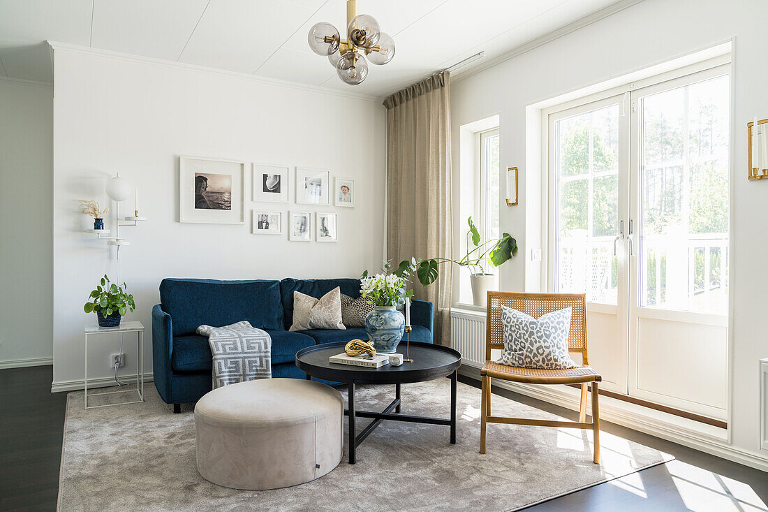 Seating area in the living room in front of patio doors