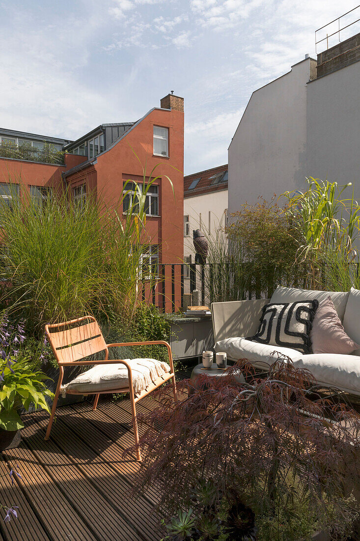 Seating furniture on terrace with plants