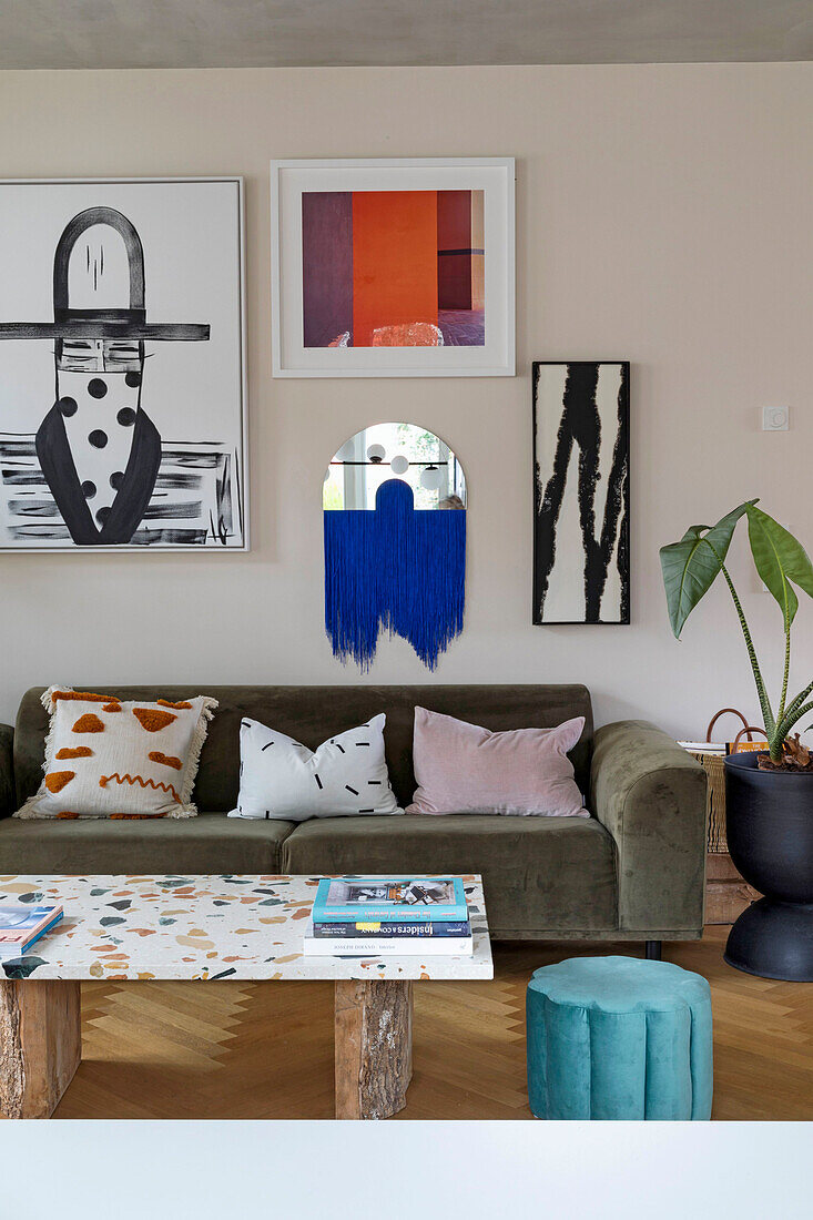 Seating area with sofa and modern artwork in open-plan living room