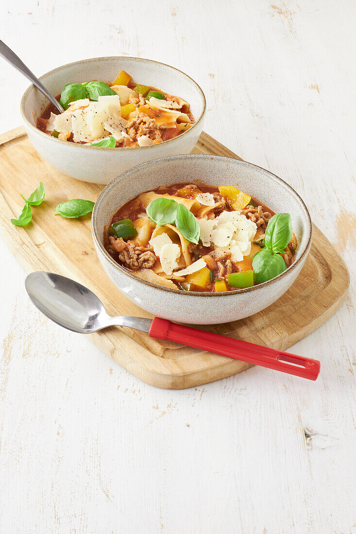 Lasagne soup with minced meat, peppers and Parmesan cheese