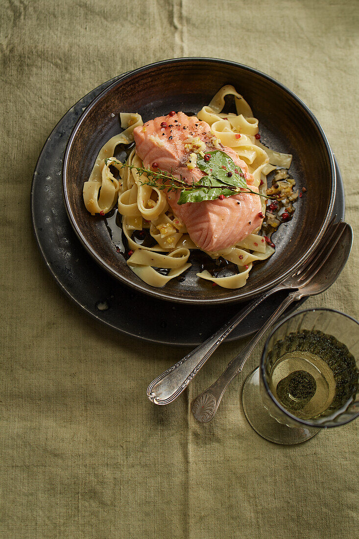 Confit salmon with ribbon noodles in peppercorn, ginger lemon sauce