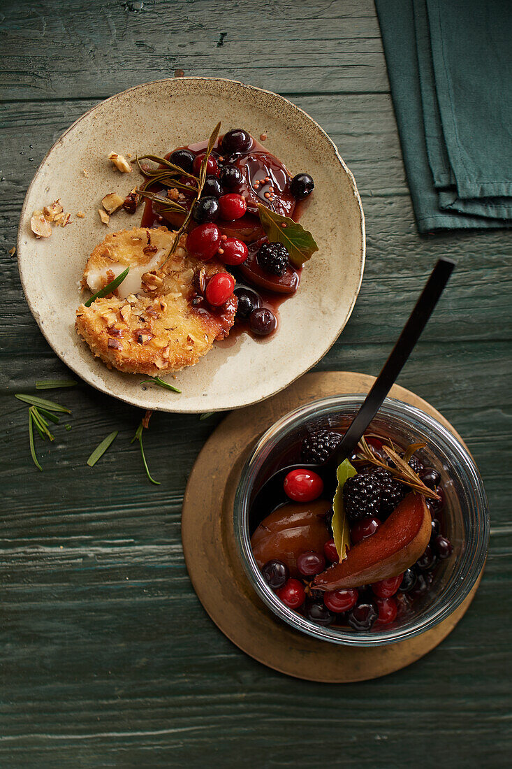 Goat cheese in nut crust with mixed balsamic fruit