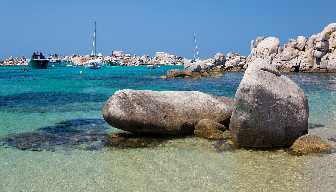 Granite boulders in the tranquil waters of Cala Lazarina, Lavezzu, Lavezzi Islands, Bonifacio, Corse-du-Sud, Corsica, France, Mediterranean, Europe
