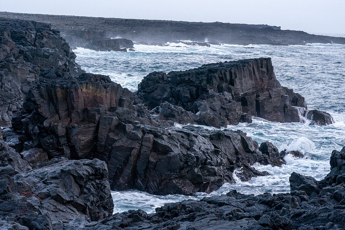 Storm waves hitting black basalt rock, Brimketill, Reykjanes peninsula, Iceland, Polar Regions