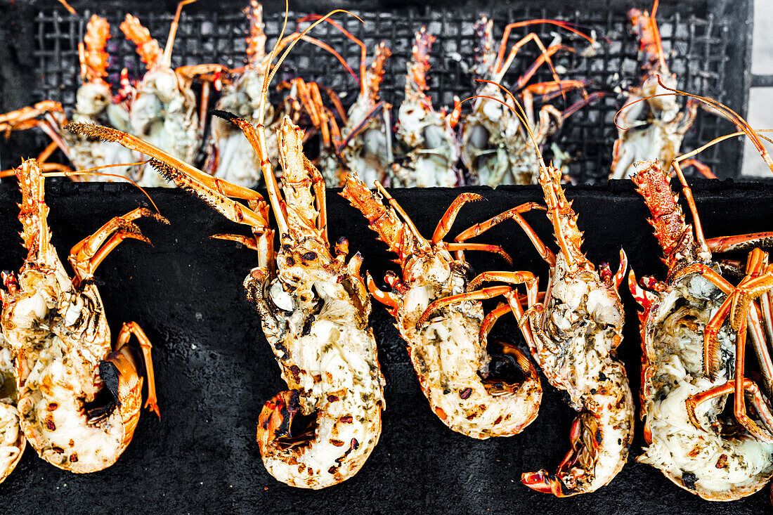 Overhead view of lobsters cooking on a barbecue grill, Antigua, Leeward Islands, West Indies, Caribbean, Central America