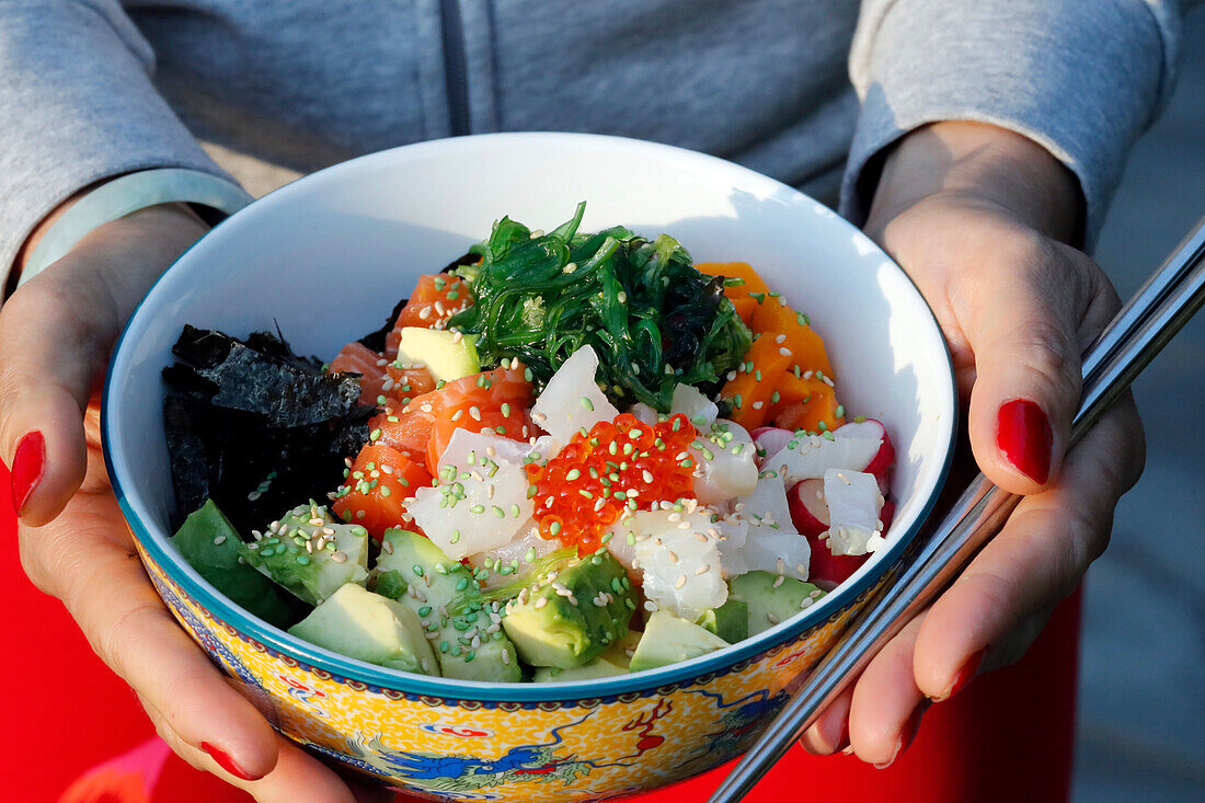 Asian cuisine, fish poke bowl with seaweed, avocado, cucumber, radish, sesame seeds, Haute-Savoie, France, Europe
