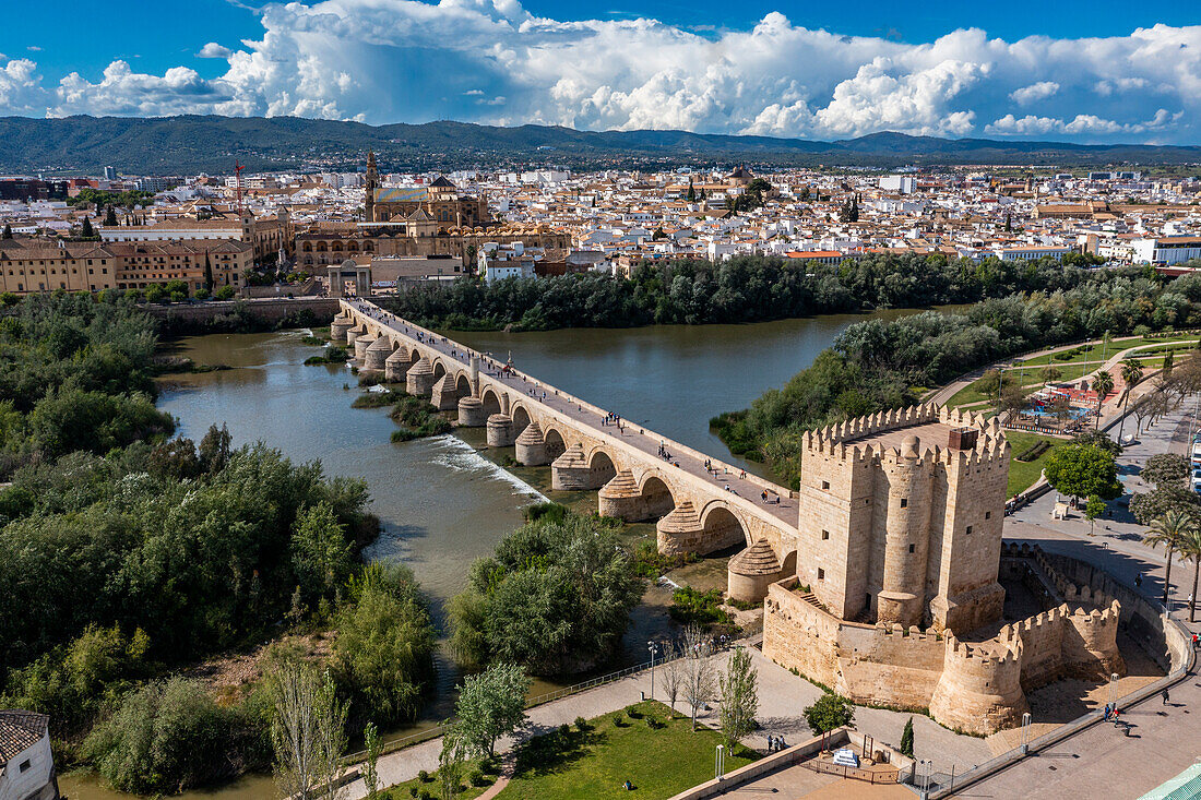 Aerial of the Historic Roman Bridge over the Guadalquivir River and Calahorra Tower, UNESCO World Heritage Site, Cordoba, Andalusia, Spain, Europe