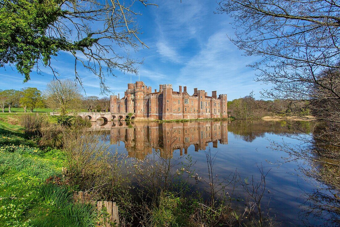 The moat of the brick built 15th century Herstmonceux Castle, East Sussex, England, United Kingdom, Europe