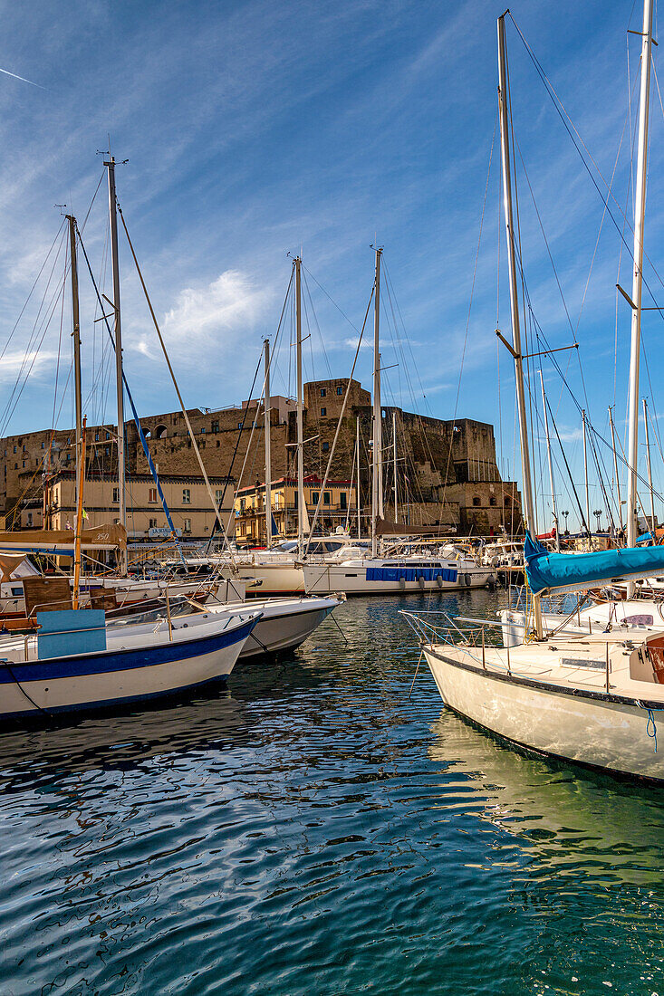 Small harbor with boats in front of the Castel dell'Ovo, Naples, Campania, Italy, Europe