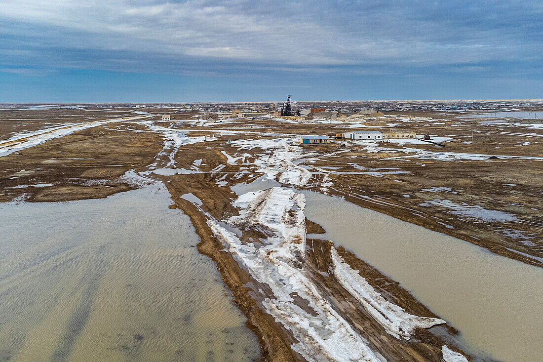 Aerial of an old wheat farm in the semi frozen earth, South of Kostanay, northern Kazakhstan, Central Asia, Asia