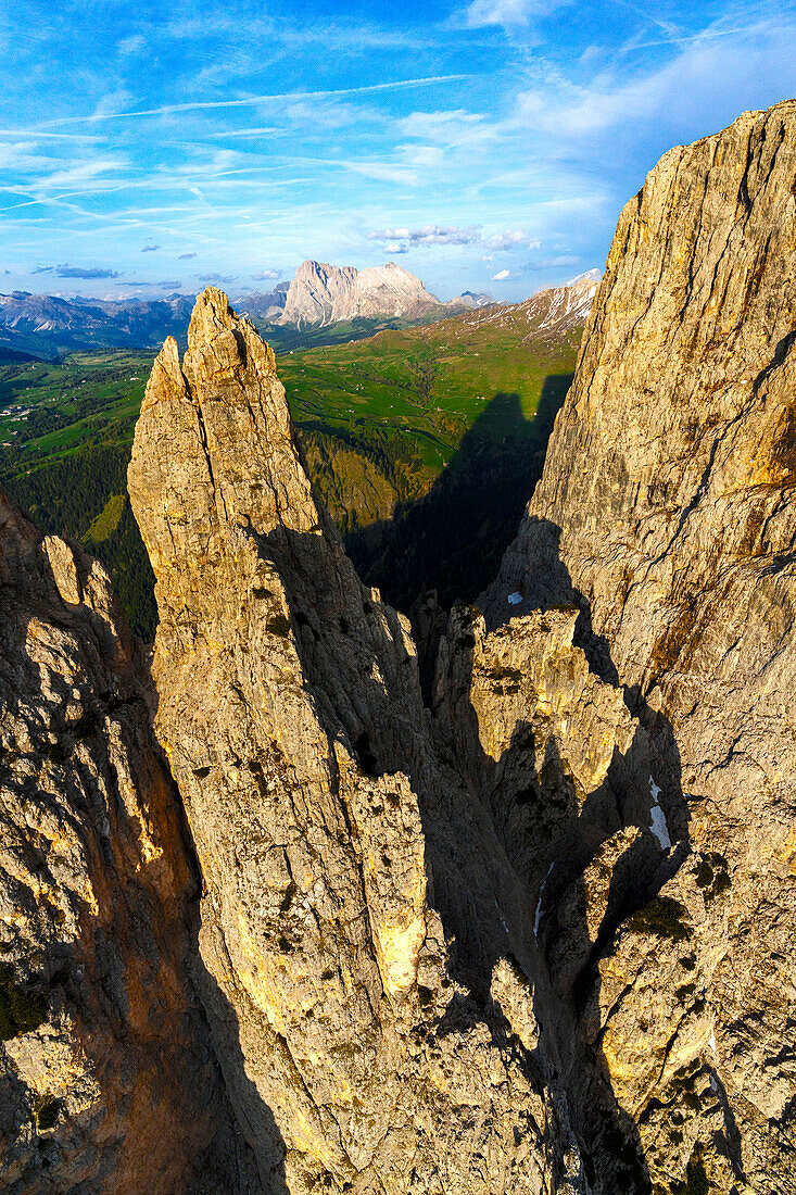 Aerial view of Sciliar with Sassopiatto and Sassolungo mountains in background, Seiser Alm, Dolomites, South Tyrol, Italy, Europe