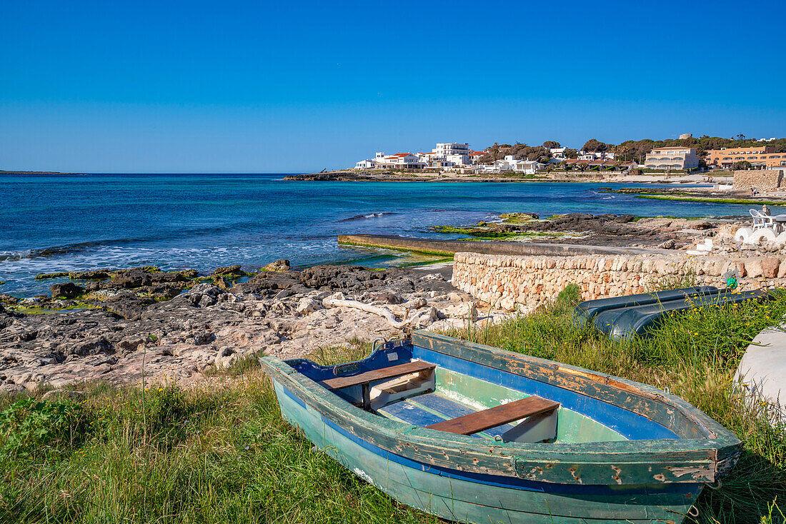 View of Playa Punta Prima and rowing boat on sunny morning, Punta Prima, Menorca, Balearic Islands, Spain, Mediterranean, Europe