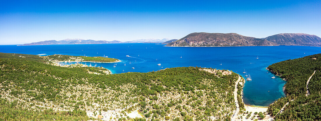 Aerial view of green woods surrounding the blue sea at the idyllic Foki beach, Fiskardo, Kefalonia, Ionian Islands, Greek Islands, Greece, Europe