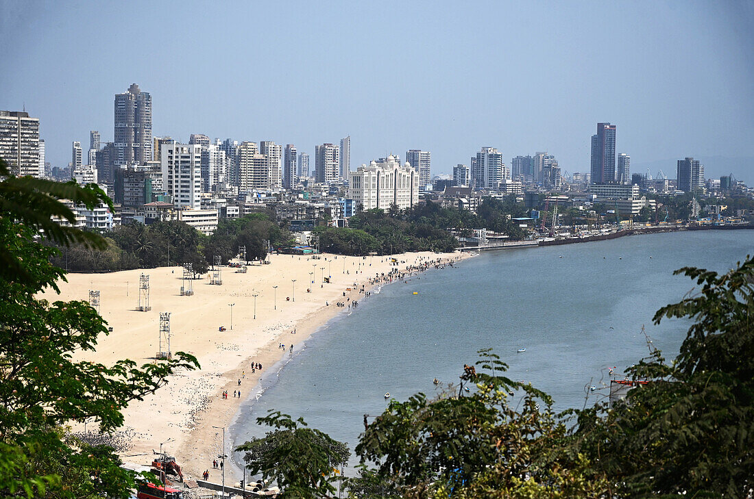 Looking down on Mumbai beachfront with the highrise modern city beyond, from Malabar Hill, Mumbai, India, Asia
