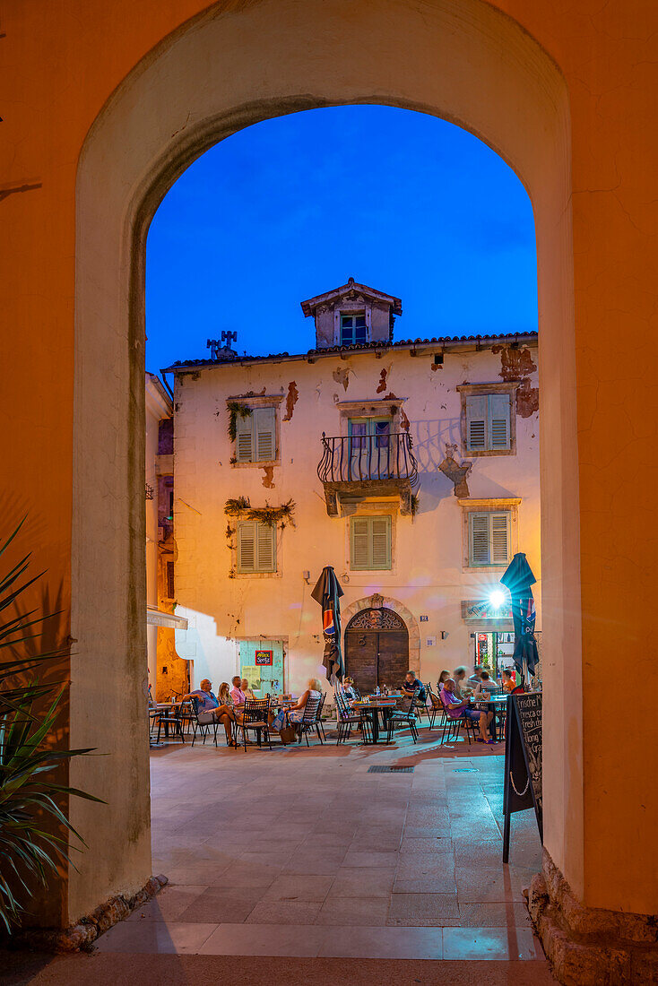 View of restaurants at dusk, Lovran, Kvarner Bay, Eastern Istria, Croatia, Europe