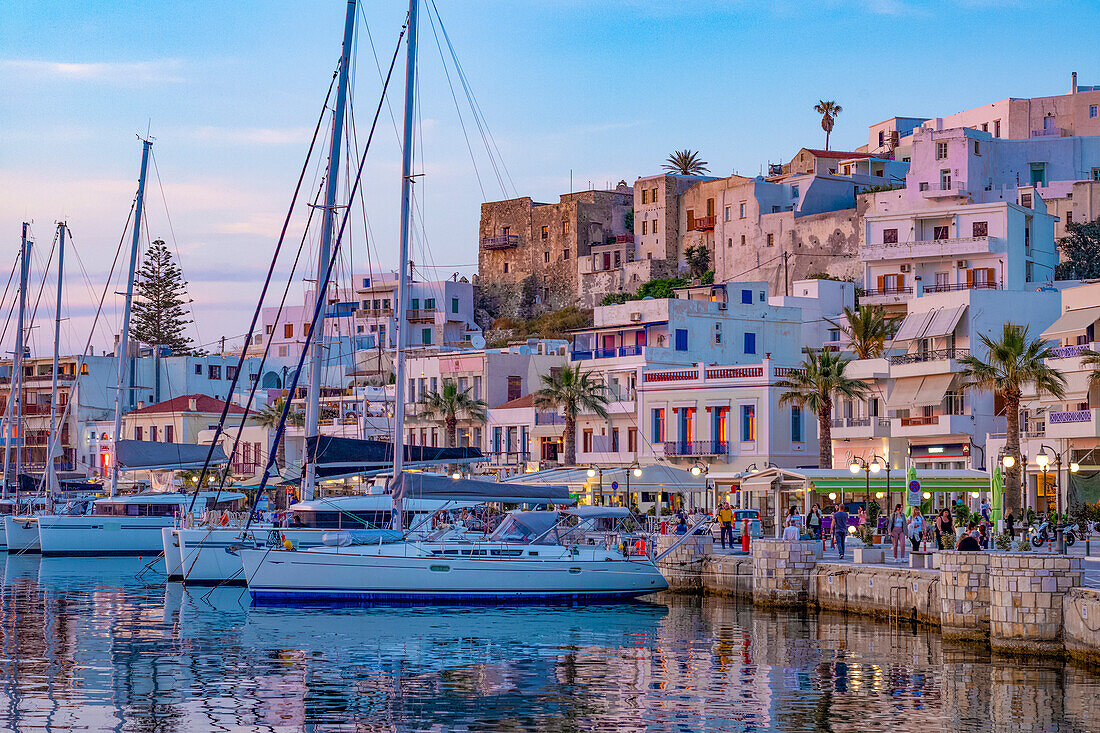 Dusk with yachts moored at the harbour waterfront in Naxos Town, Naxos, the Cyclades, Aegean Sea, Greek Islands, Greece, Europe