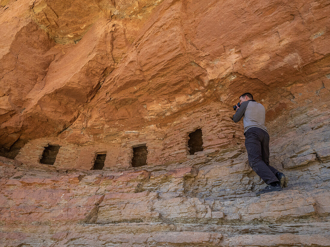 Photographing at the Puebloan granaries at Upper Nankoweap, Grand Canyon National Park, Arizona, United States of America, North America