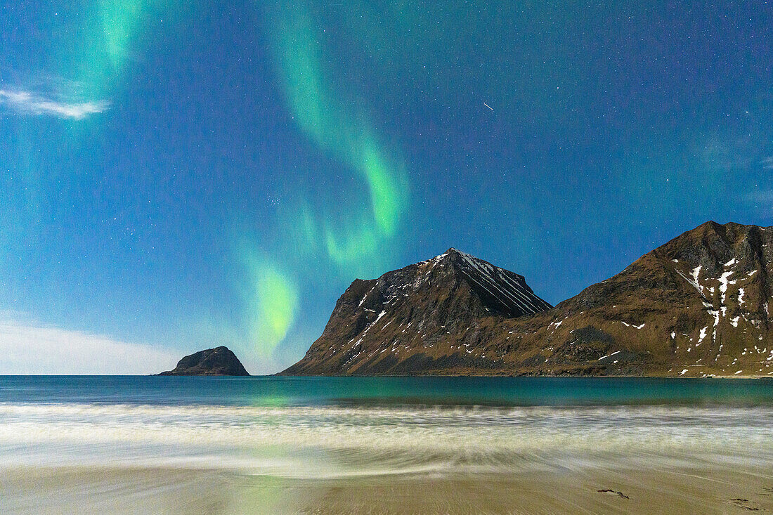 Northern Lights (Aurora Borealis) over the frozen Haukland beach, Leknes, Nordland county, Lofoten Islands, Norway, Scandinavia, Europe