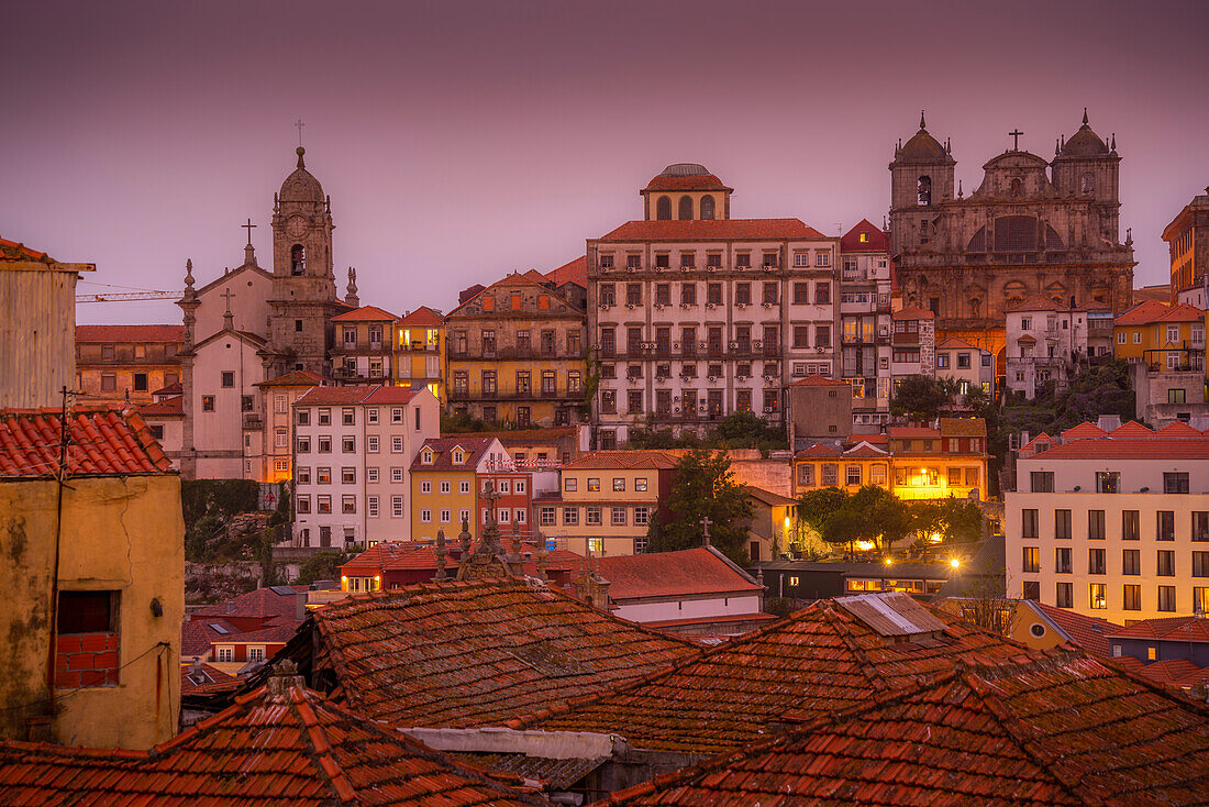 View of buildings and terracota rooftops of The Ribeira district at dusk, UNESCO World Heritage Site, Porto, Norte, Portugal, Europe