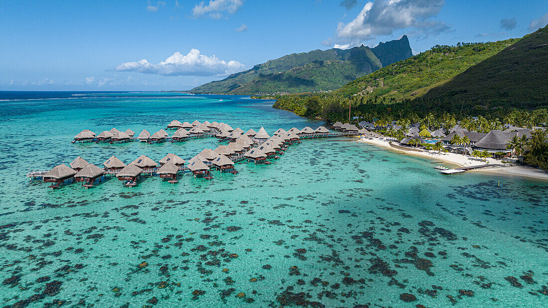 Aerial of overwater bungalows in the lagoon of Moorea (Mo'orea), Society Islands, French Polynesia, South Pacific, Pacific