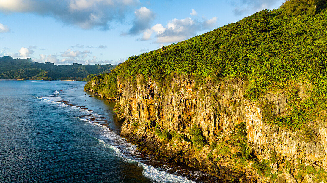 Limestone cliffs at sunset, Rurutu, Austral islands, French Polynesia, South Pacific, Pacific