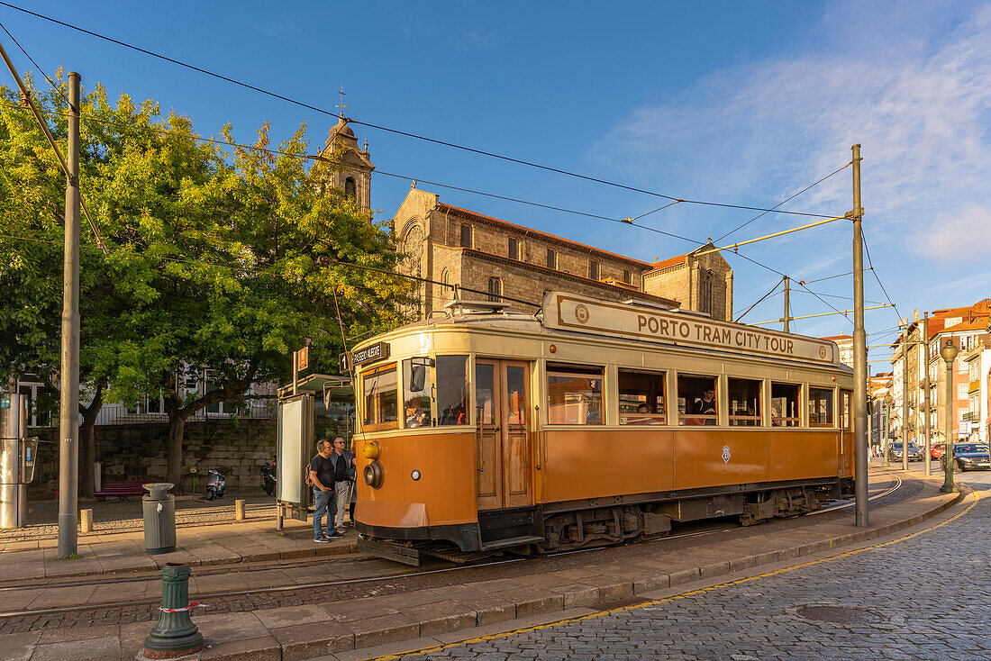 View of iconic city tram and Monument Church of St. Francis, Porto, Norte, Portugal, Europe