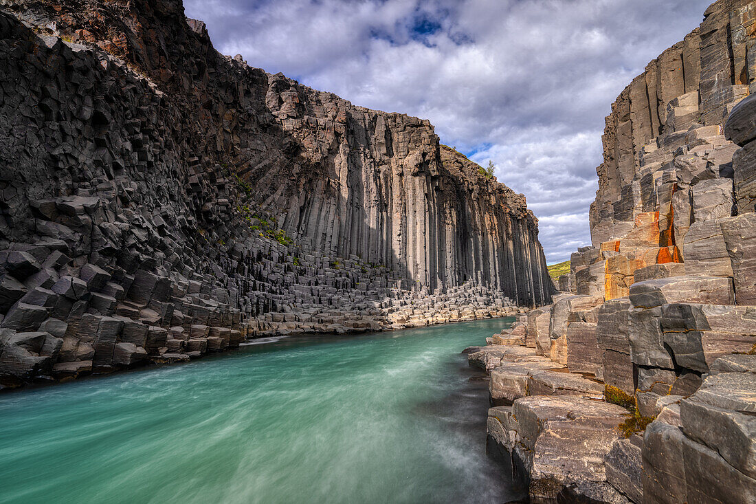 The basalt cliffs of Studlagil Canyon, Iceland, Polar Regions
