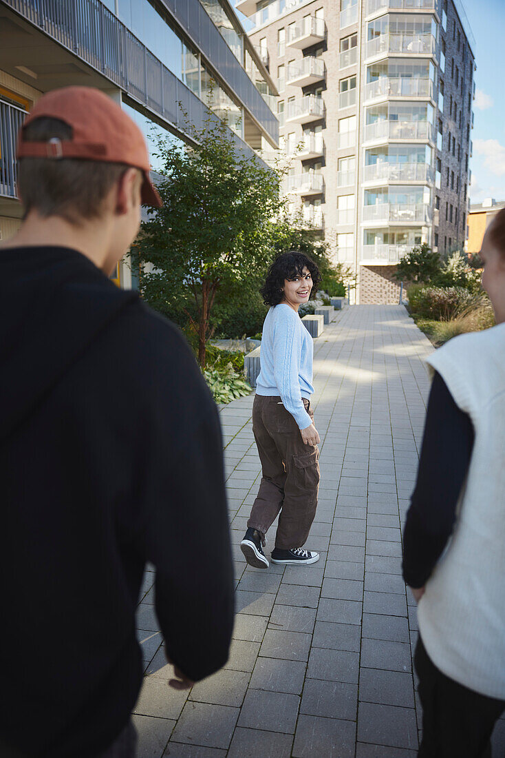 Smiling friends walking together