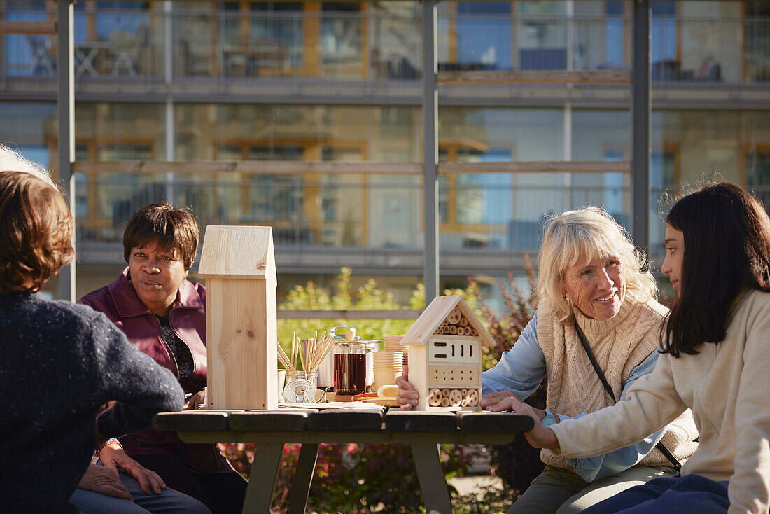 Neighbors making bug hotels together