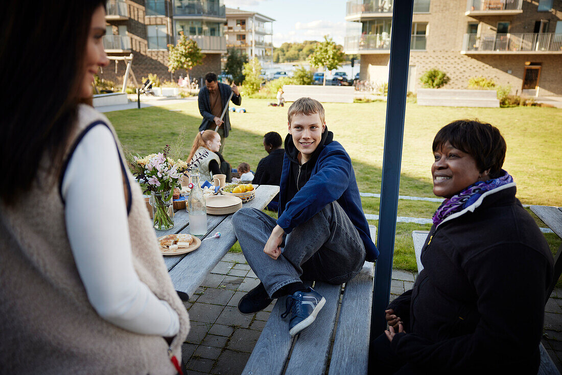 Neighbors relaxing in communal outdoor area