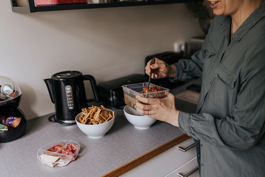 Woman preparing food in kitchen