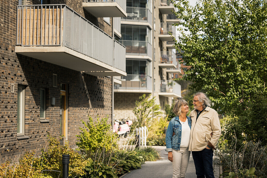 Senior couple standing in residential area