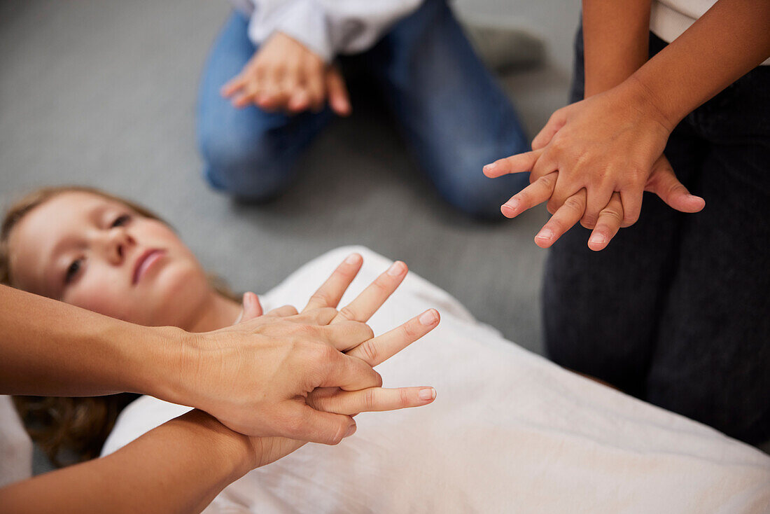 Teacher giving first aid training