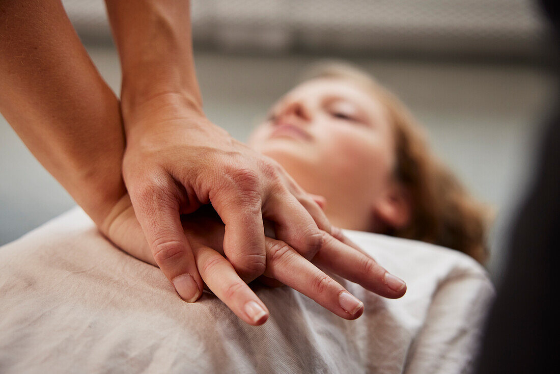 Teacher giving first aid training