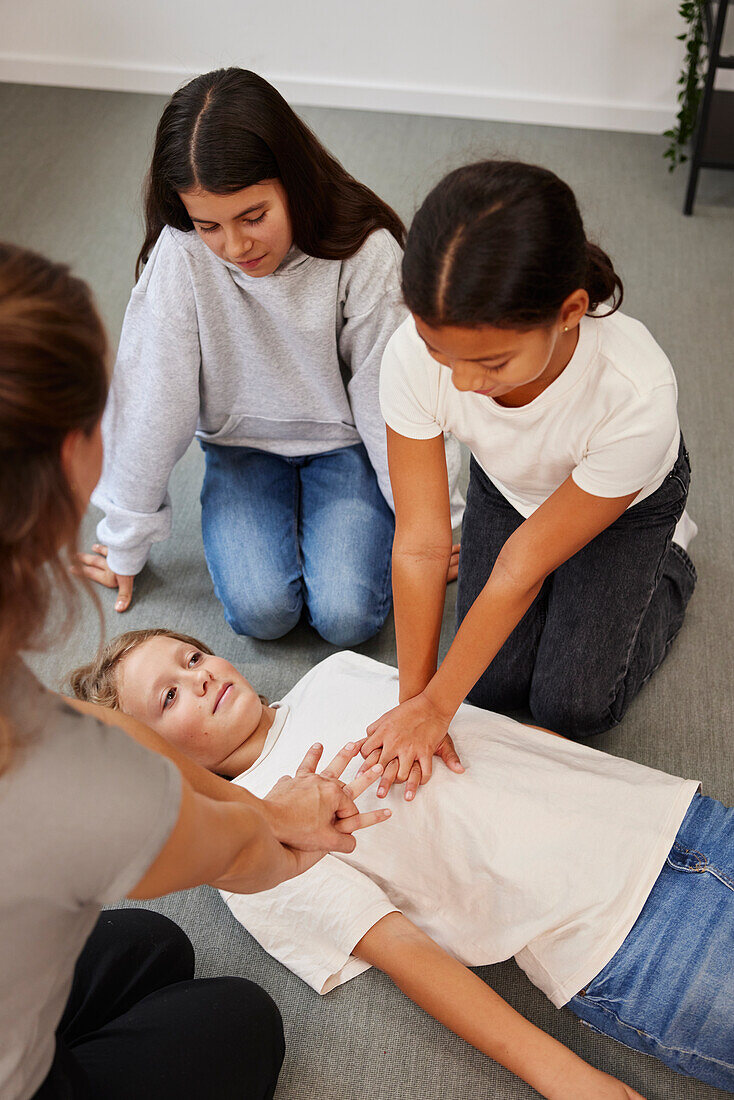 Teacher giving first aid training