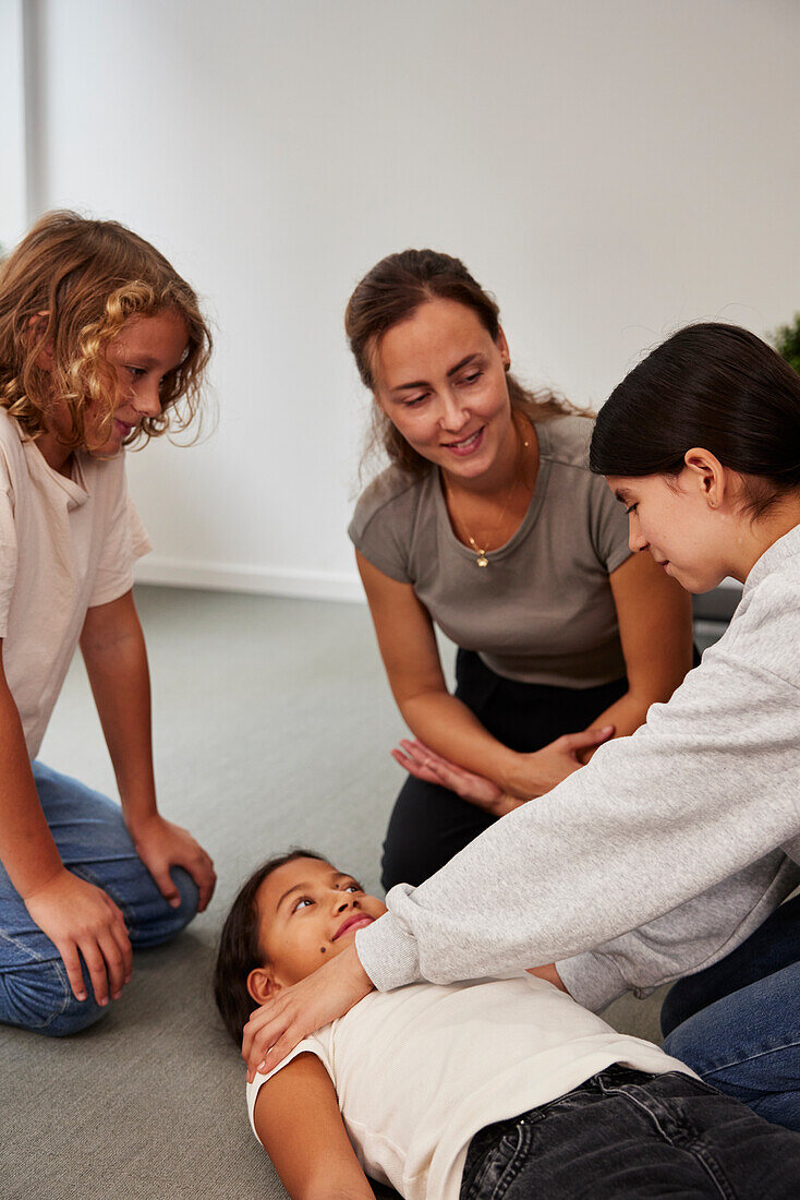 Teacher giving first aid training