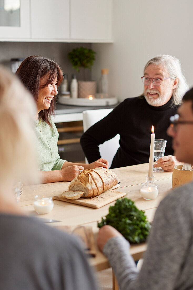Family sitting at table at home