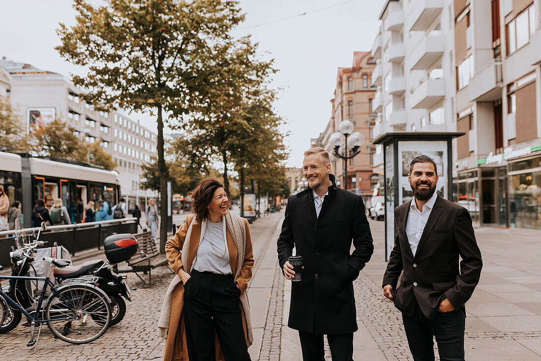 Smiling business people standing together