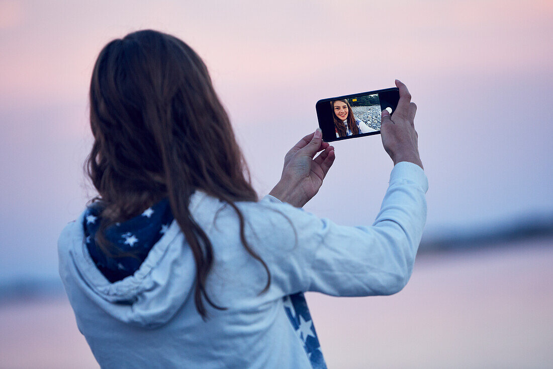 Teenage girl taking selfie