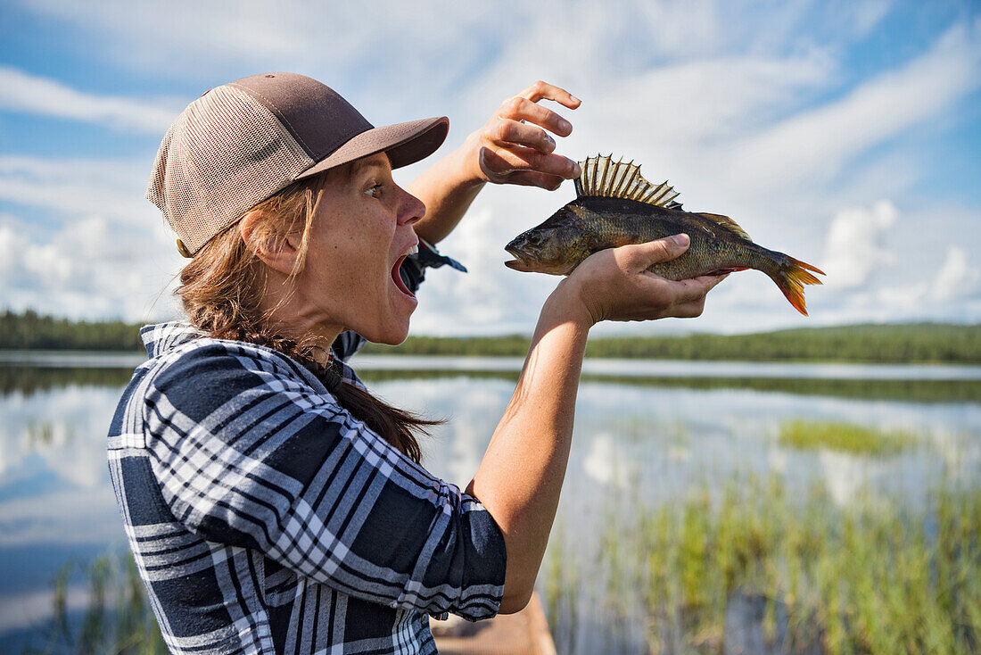 Woman holding fish